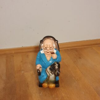 Mand i gyngestol sparegris