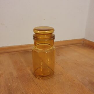 Gult apoteker glas med låg