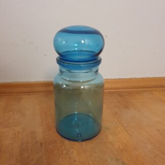 Blåt apoteker glas med låg