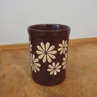 Brun krukke med blomster