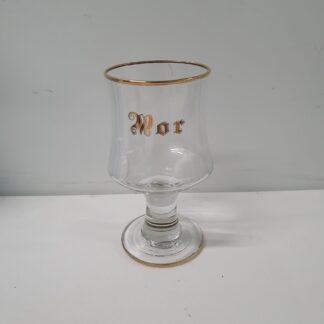 Glas med ordet Mor på